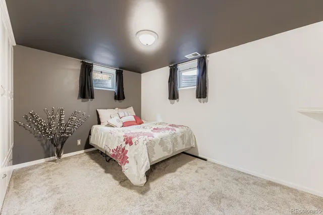 a bedroom with a bed and a view of bathroom