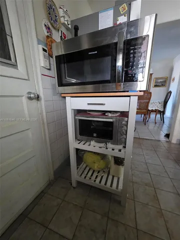 a kitchen with a stove and a microwave