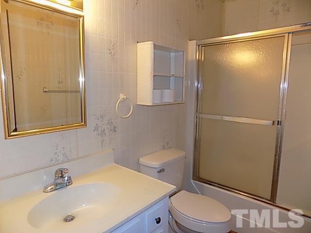1243 Marler Road Benson, NC 27504 - Photo 22 of 29 a bathroom with a sink a toilet and shower