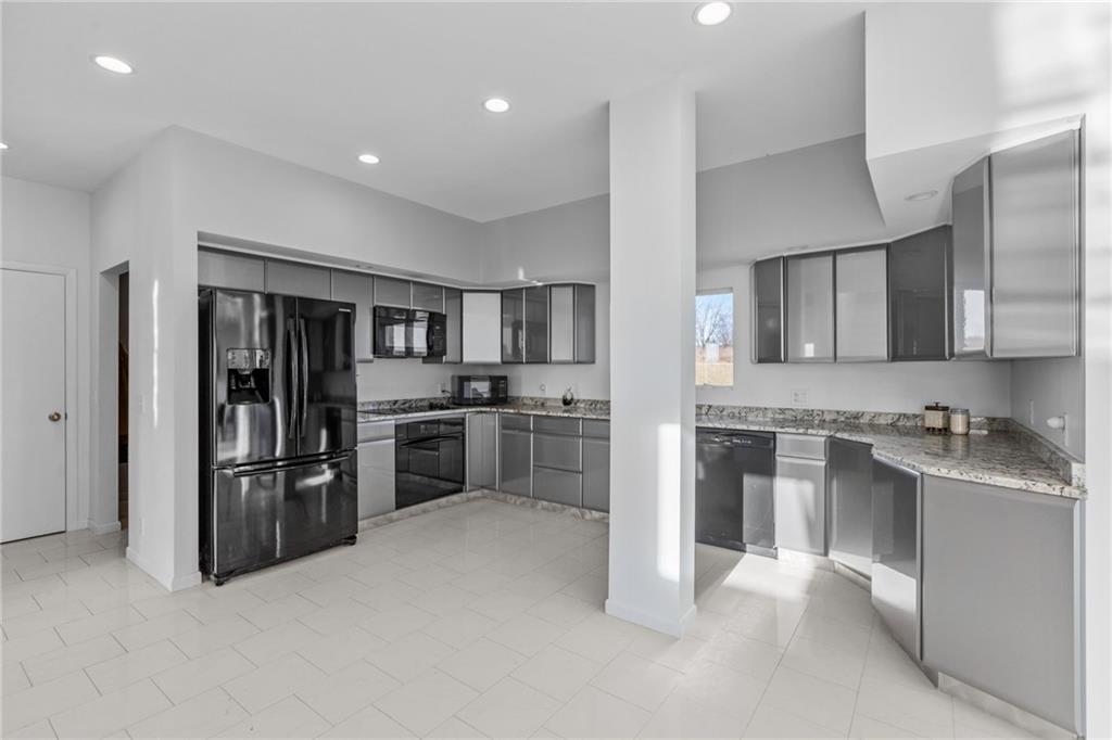 427 Jones Road Harrisville, PA 16038 - Photo 11 of 29 a kitchen with cabinets and stainless steel appliances