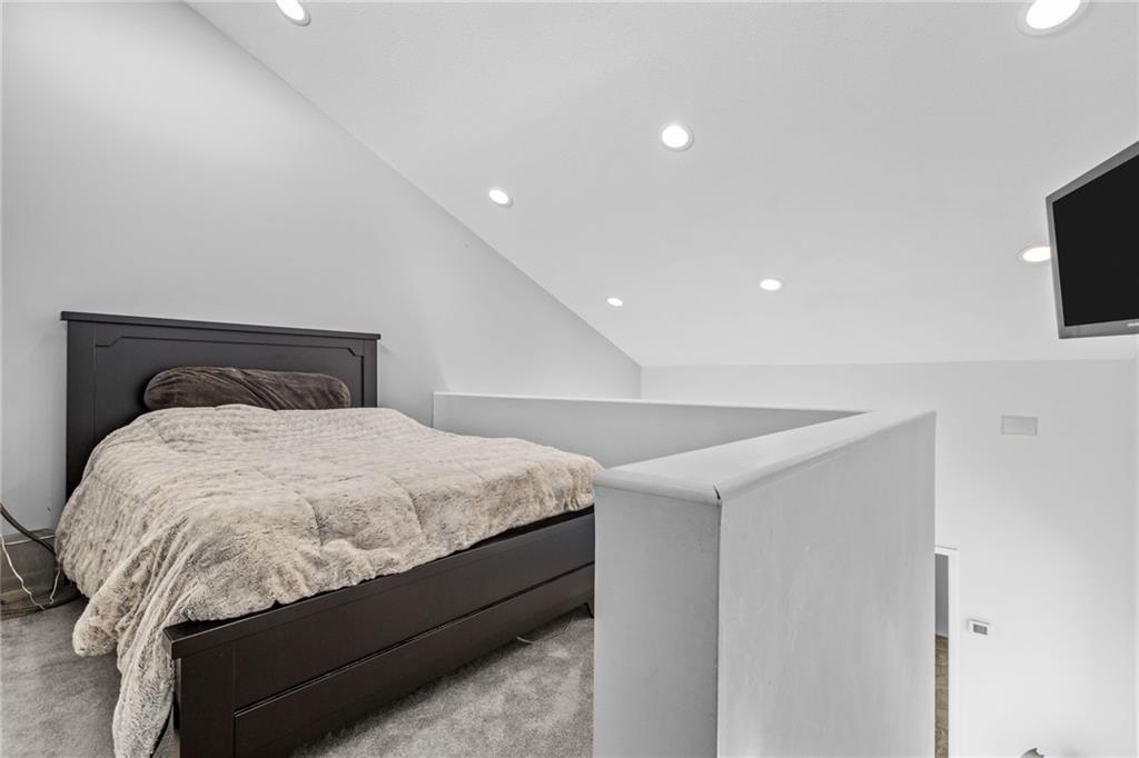 427 Jones Road Harrisville, PA 16038 - Photo 20 of 29 a bedroom with a bed and a flat screen tv