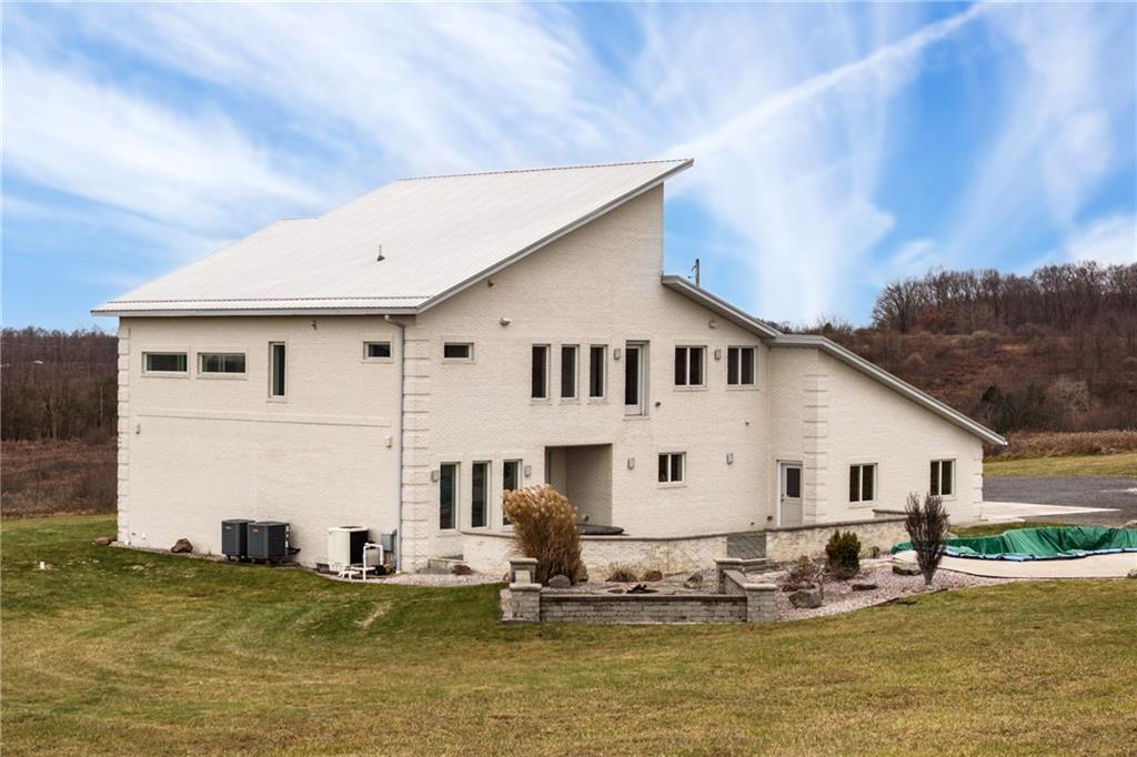 427 Jones Road Harrisville, PA 16038 - Photo 3 of 29 a view of a large white building with swimming pool in front of it