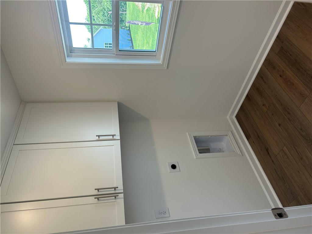 211 Bellflower Lane Anderson, SC 29625 - Photo 21 of 28 Ample storage cabinetry and hardwood flooring enhance this well-lit utility space.