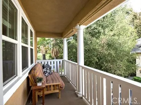 a view of balcony with furniture