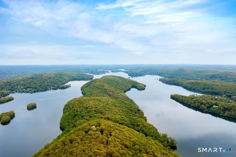 a view of a garden with an outdoor seating