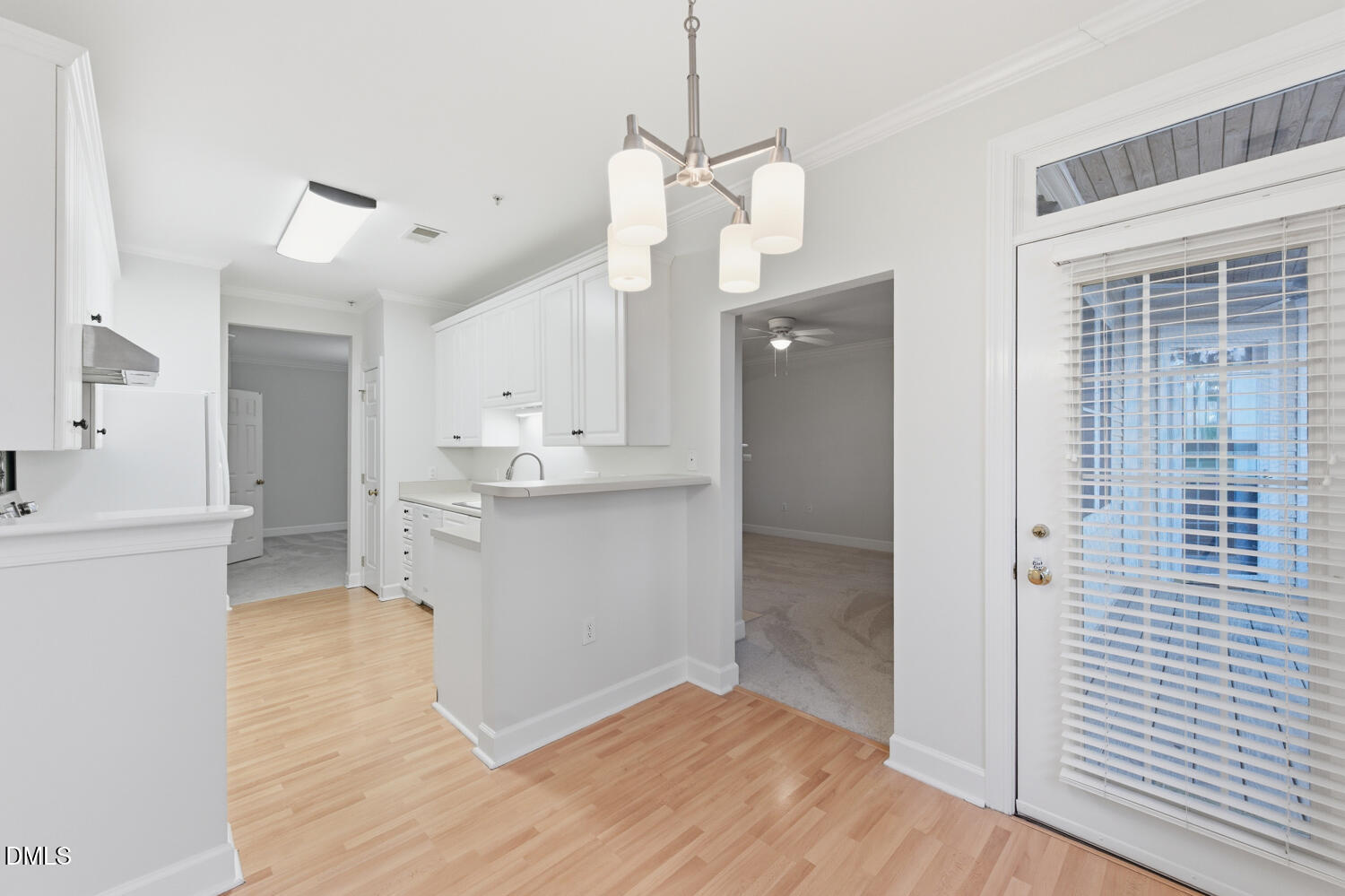 116 Northbrook Drive, Unit 204 Raleigh, NC 27609 - Photo 27 of 94 a view of a kitchen with wooden floor and a kitchen