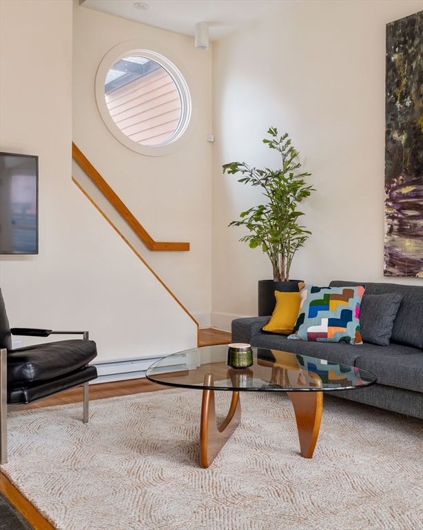 61 Dana Street, Unit 4 Cambridge, MA 02138 - Photo 13 of 25 a living room with furniture and a potted plant