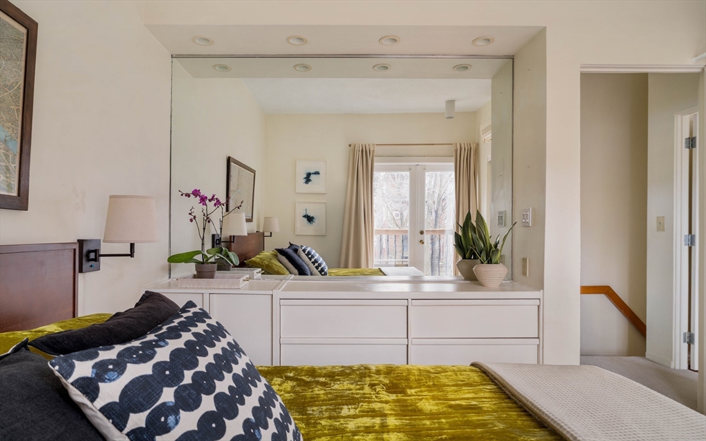61 Dana Street, Unit 4 Cambridge, MA 02138 - Photo 14 of 25 a bedroom with a bed and a potted plant