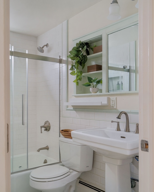 61 Dana Street, Unit 4 Cambridge, MA 02138 - Photo 22 of 25 a bathroom with a sink toilet and shower