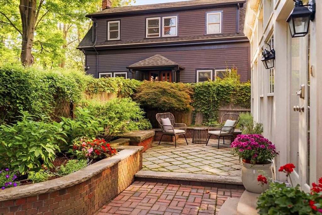 61 Dana Street, Unit 4 Cambridge, MA 02138 - Photo 23 of 25 a front view of a house with a porch