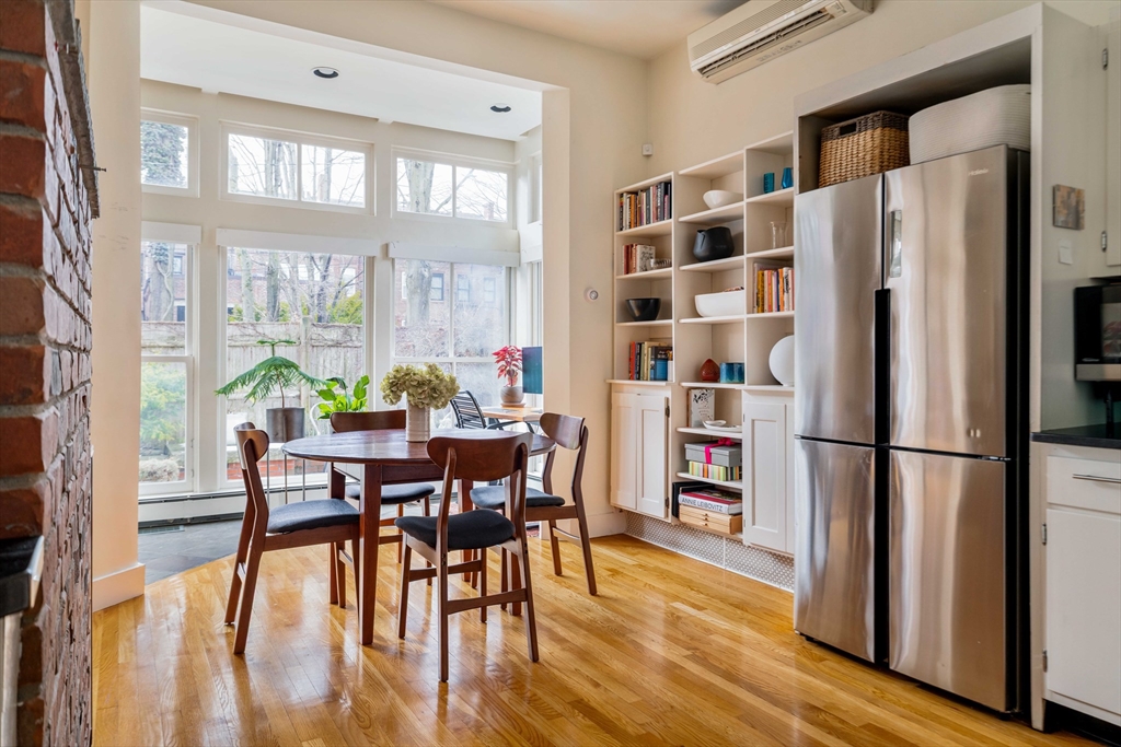 61 Dana Street, Unit 4 Cambridge, MA 02138 - Photo 6 of 25 a view of a dining room with furniture window and wooden floor