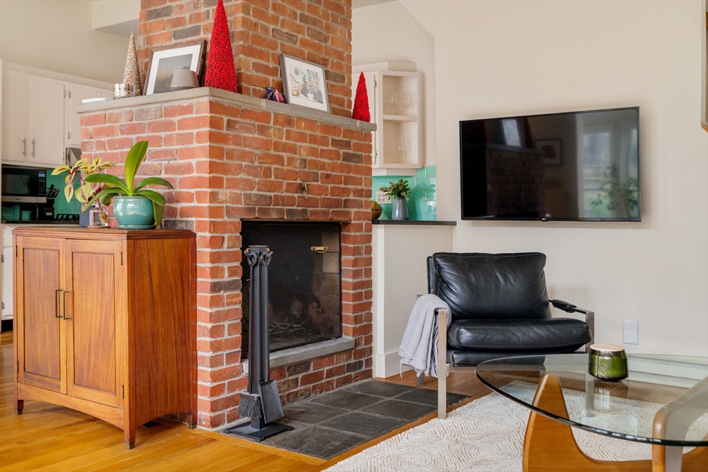 61 Dana Street, Unit 4 Cambridge, MA 02138 - Photo 10 of 25 a living room with furniture and a fireplace