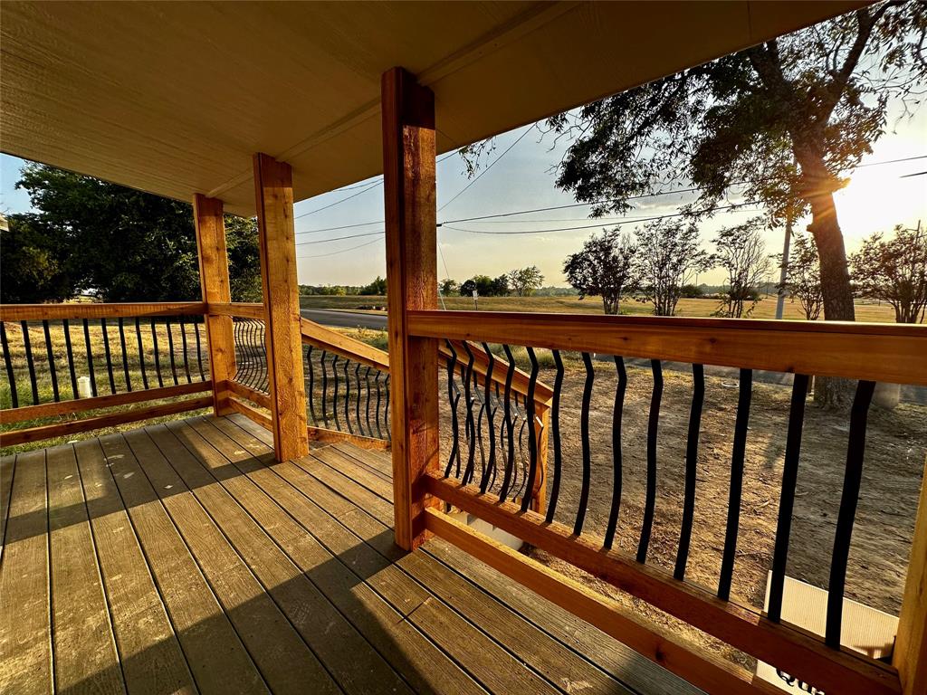 a view of balcony with wooden floor