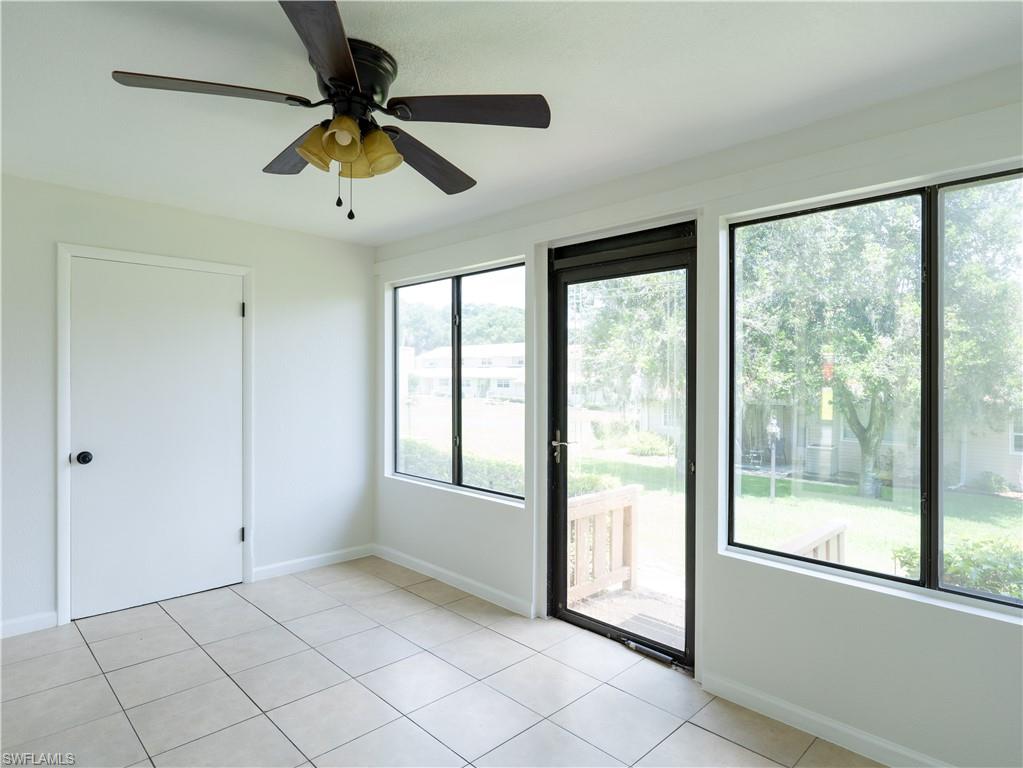 11001 Southeast Sunset Harbor Road, Unit 34 Summerfield, FL 34491 - Photo 12 of 31 Tiled spare room featuring ceiling fan