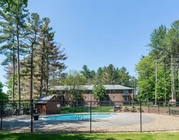 a sign board with yard in front of it