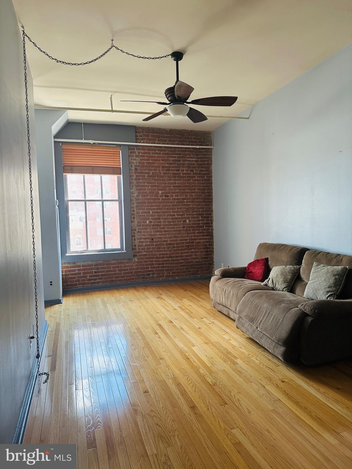 1010 Race Street, Unit 5D Philadelphia, PA 19107 - Photo 18 of 25 a living room with hardwood floor and a window