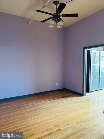 a kitchen with granite countertop a sink and a refrigerator