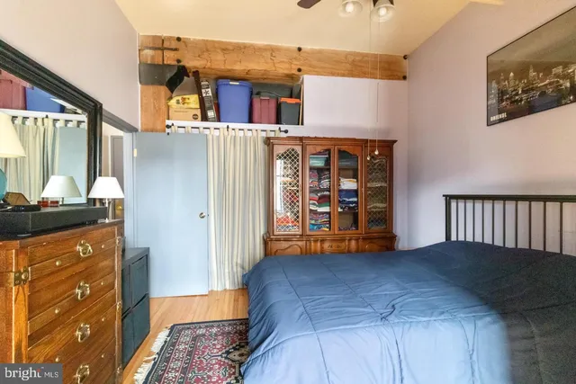 a bedroom with a bed and a dresser
