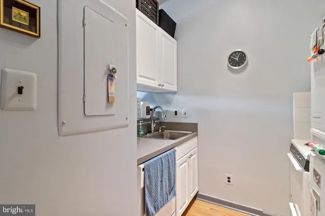 a kitchen with cabinets and window
