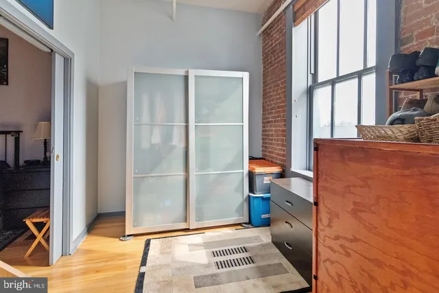 a utility room with fridge dryer and washer