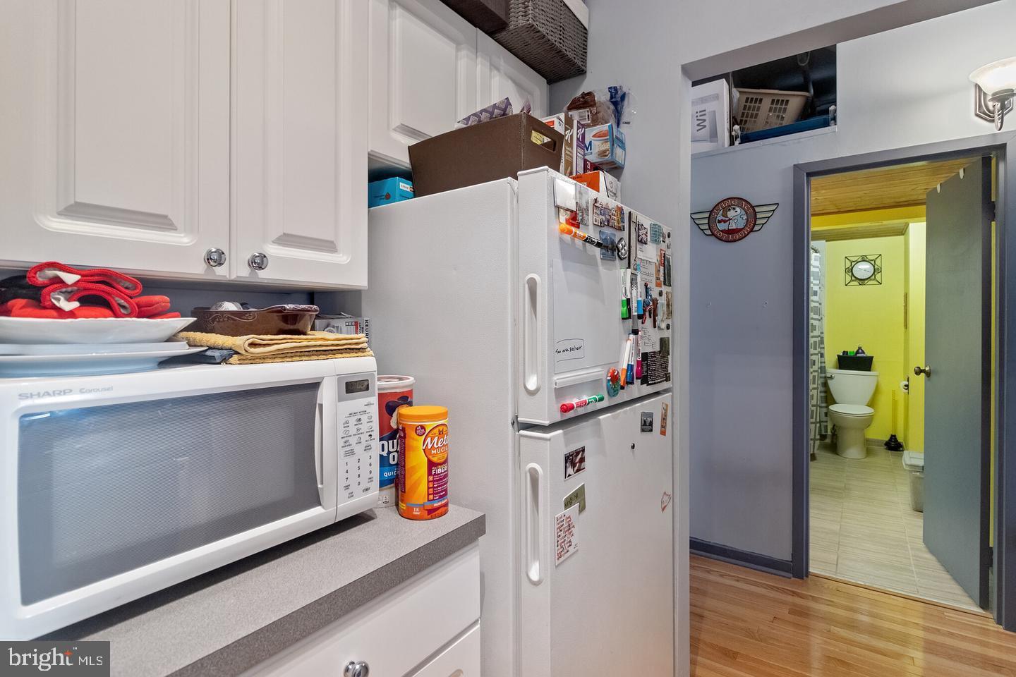 1010 Race Street, Unit 5D Philadelphia, PA 19107 - Photo 10 of 25 a utility room with fridge dryer and washer