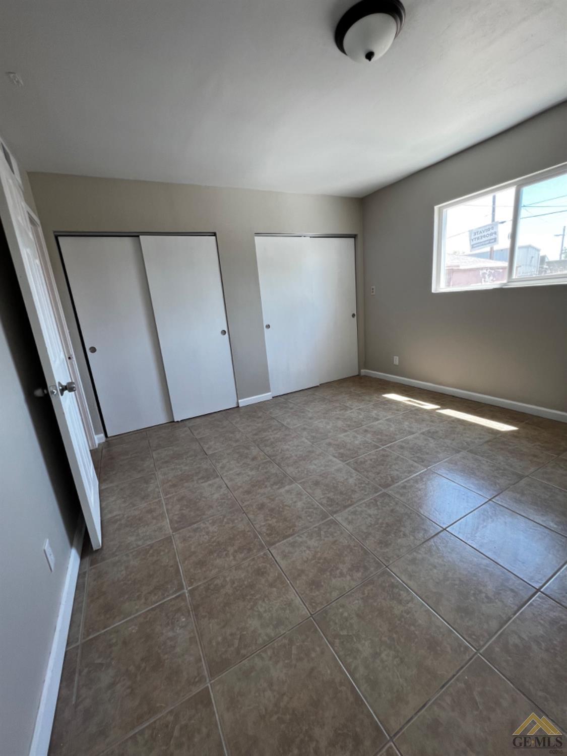 Undisclosed Address Bakersfield, CA 93304 - Photo 15 of 18 an empty room with windows