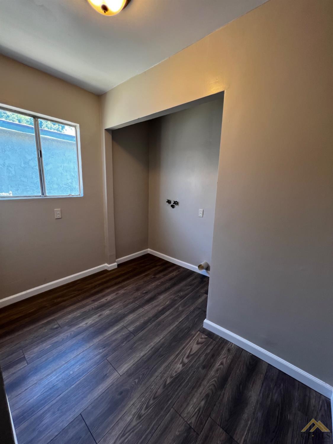 Undisclosed Address Bakersfield, CA 93304 - Photo 18 of 18 a view of a room with wooden floor and window