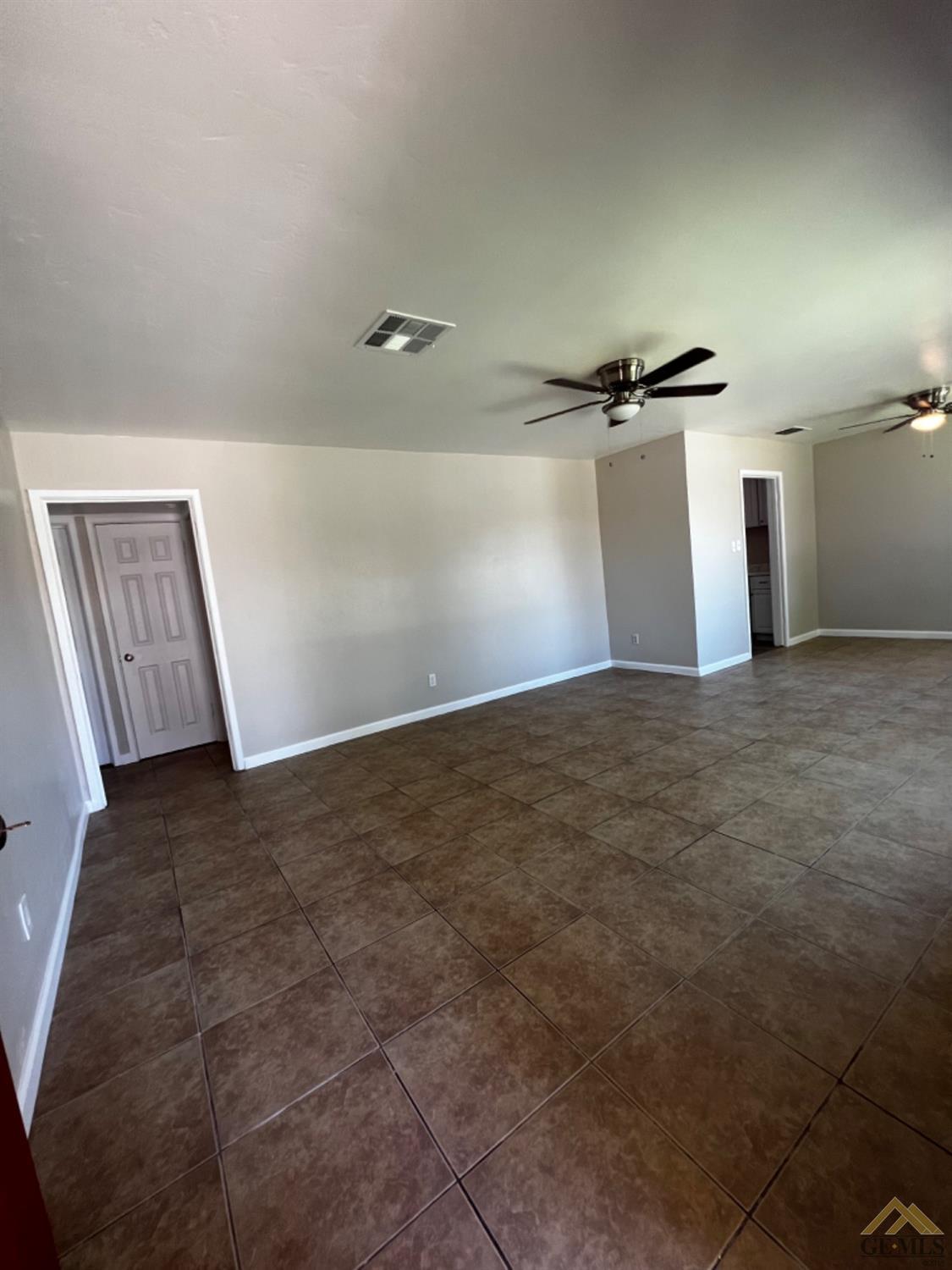 Undisclosed Address Bakersfield, CA 93304 - Photo 3 of 18 a view of a room with wooden floor