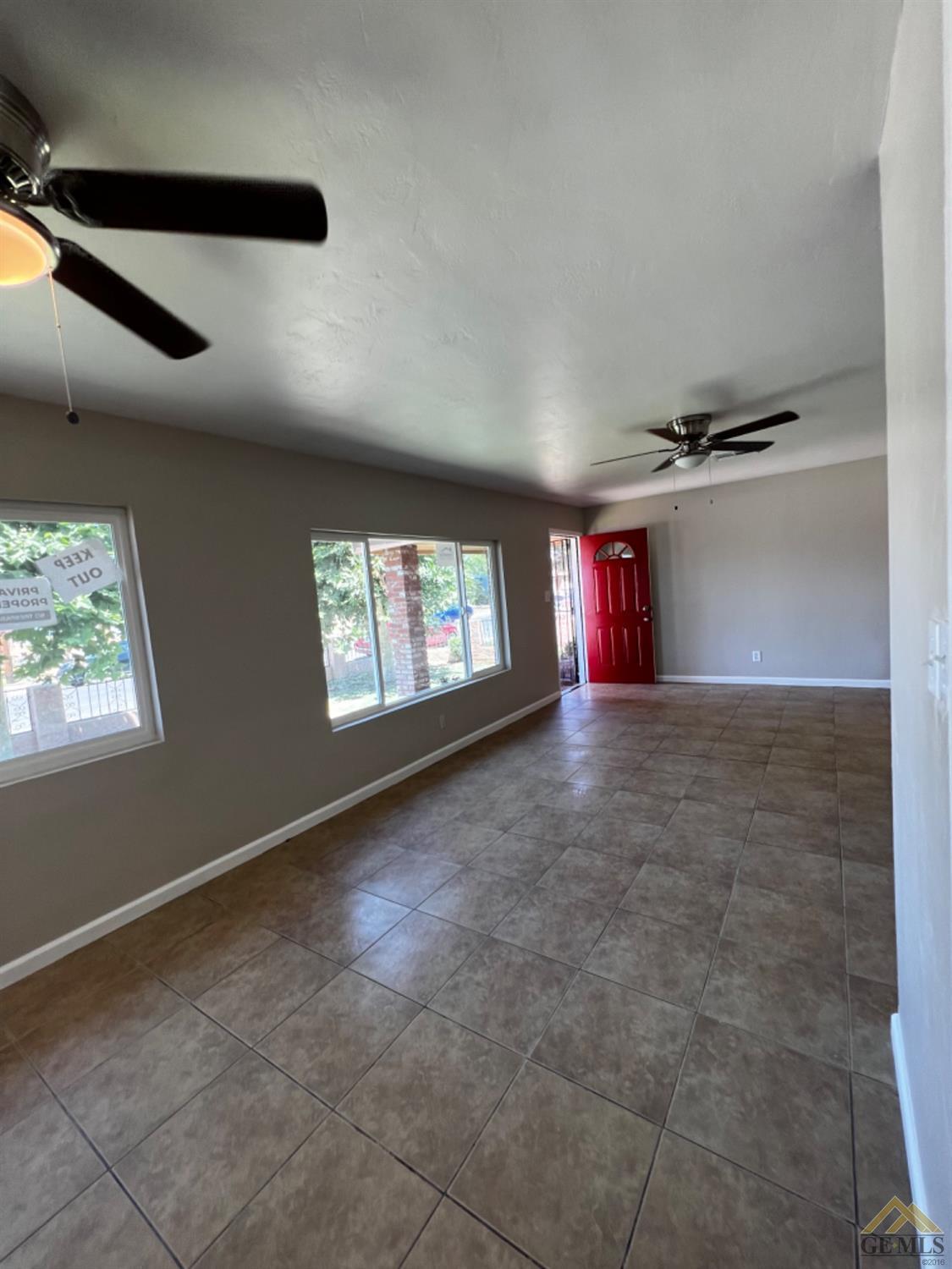 Undisclosed Address Bakersfield, CA 93304 - Photo 9 of 18 a view of empty room with wooden floor