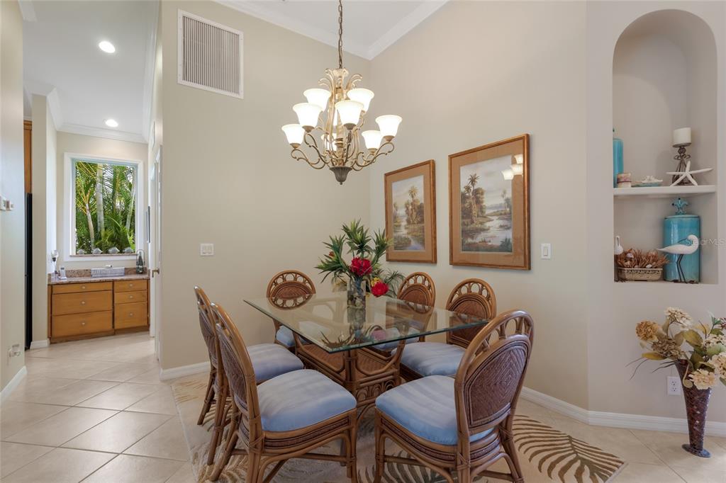 11709 Strandhill Court Lakewood Ranch, FL 34202 - Photo 13 of 51 a dining room with furniture and window