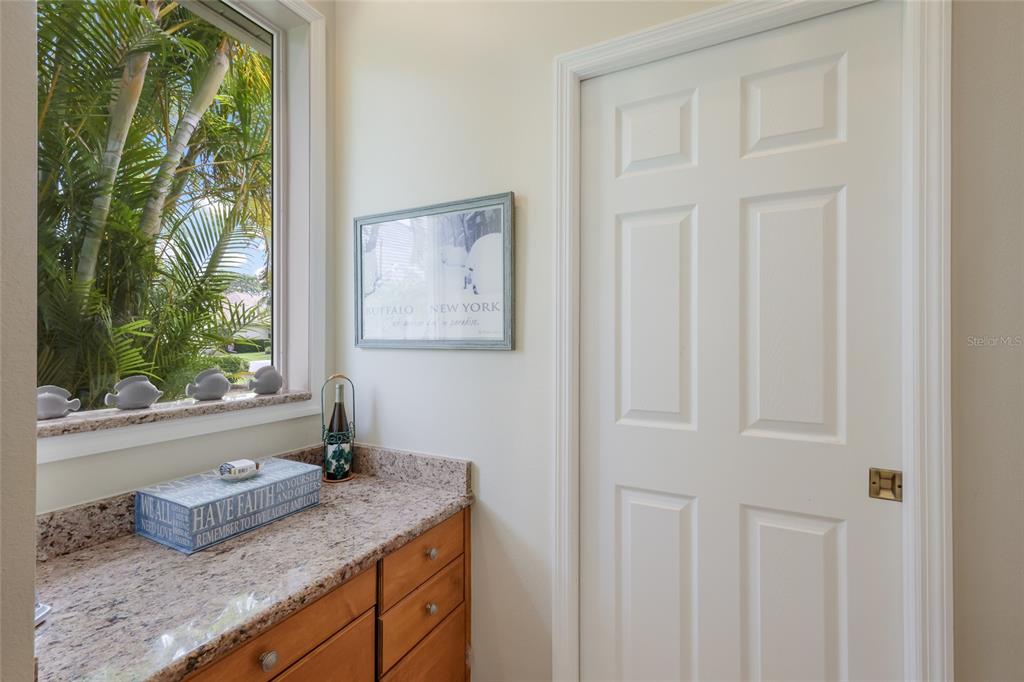 11709 Strandhill Court Lakewood Ranch, FL 34202 - Photo 14 of 51 a bathroom with a granite countertop sink and window