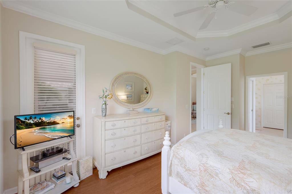 11709 Strandhill Court Lakewood Ranch, FL 34202 - Photo 20 of 51 a bedroom with a bed and a dresser