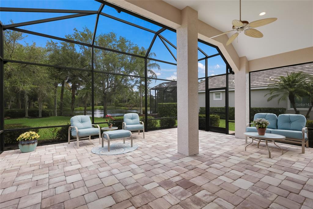 11709 Strandhill Court Lakewood Ranch, FL 34202 - Photo 2 of 51 a view of a patio with a table and chairs