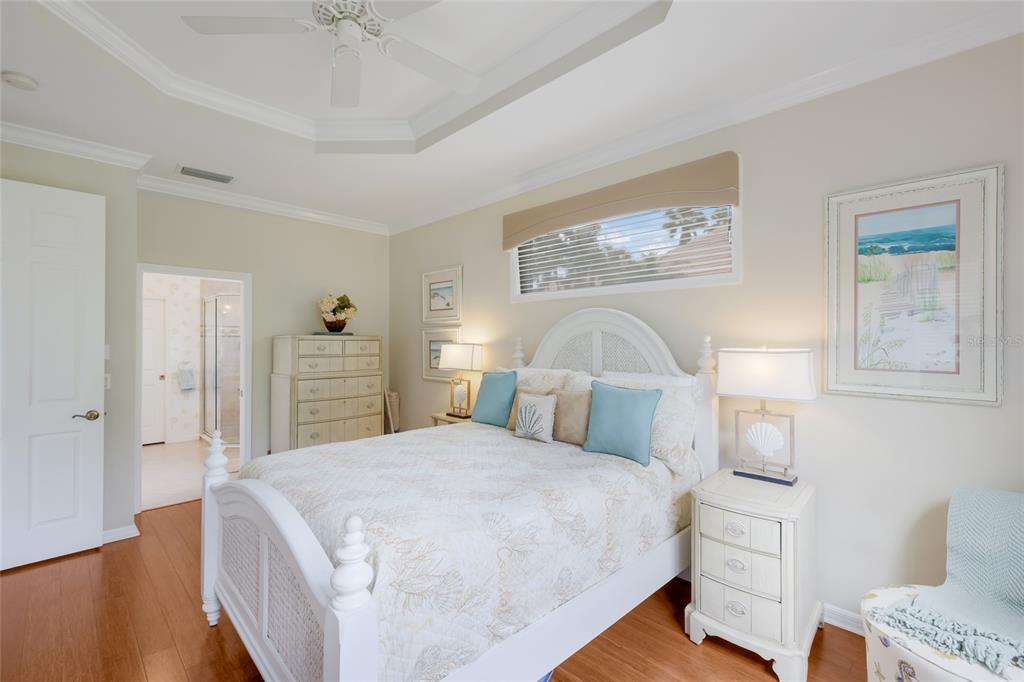 11709 Strandhill Court Lakewood Ranch, FL 34202 - Photo 21 of 51 a bedroom with a bed and a lamp