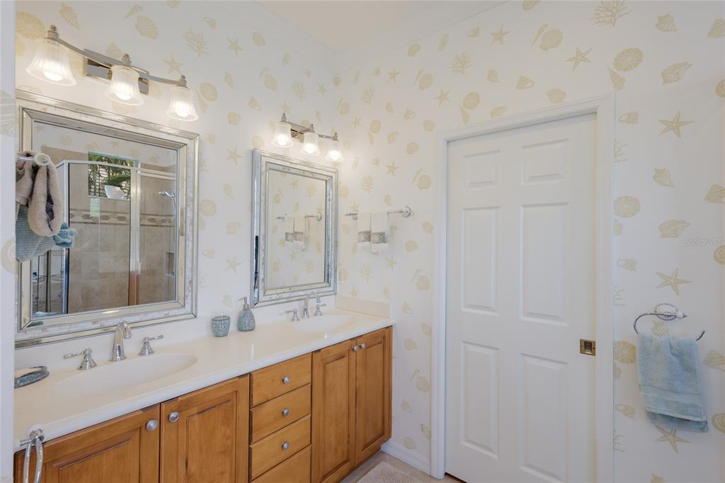 11709 Strandhill Court Lakewood Ranch, FL 34202 - Photo 22 of 51 a bathroom with a double vanity sink mirror and double