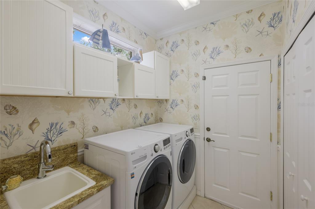 11709 Strandhill Court Lakewood Ranch, FL 34202 - Photo 28 of 51 a utility room with dryer and washer