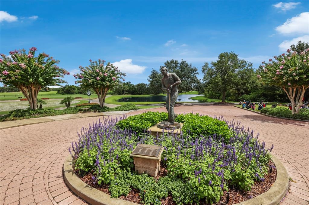 11709 Strandhill Court Lakewood Ranch, FL 34202 - Photo 38 of 51 a view of a garden with a fountain