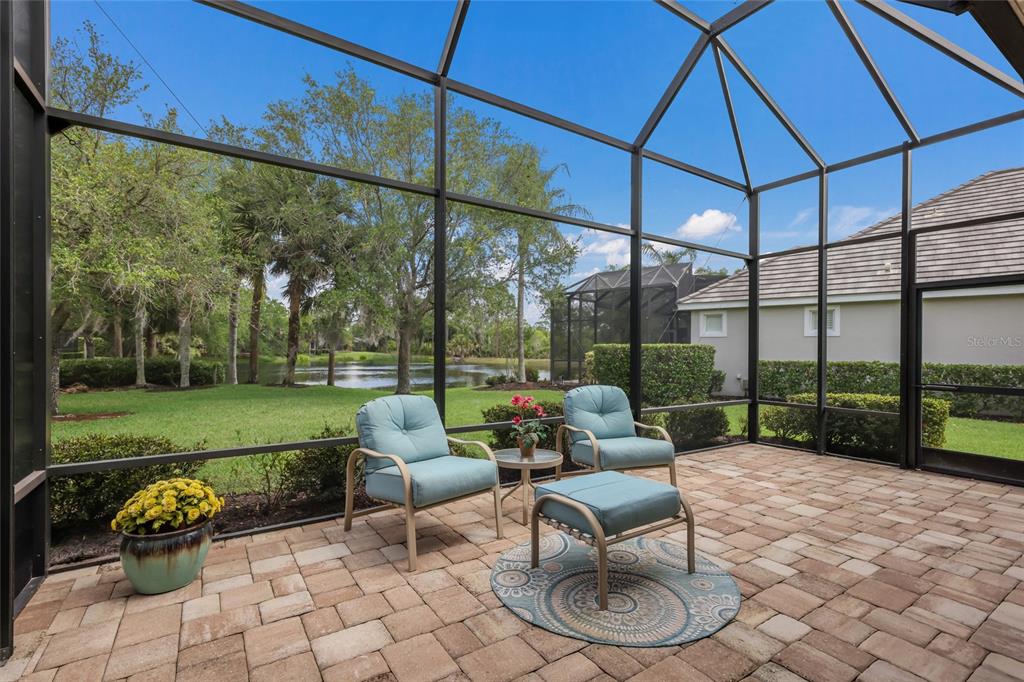 11709 Strandhill Court Lakewood Ranch, FL 34202 - Photo 4 of 51 a building outdoor space with patio furniture and garden