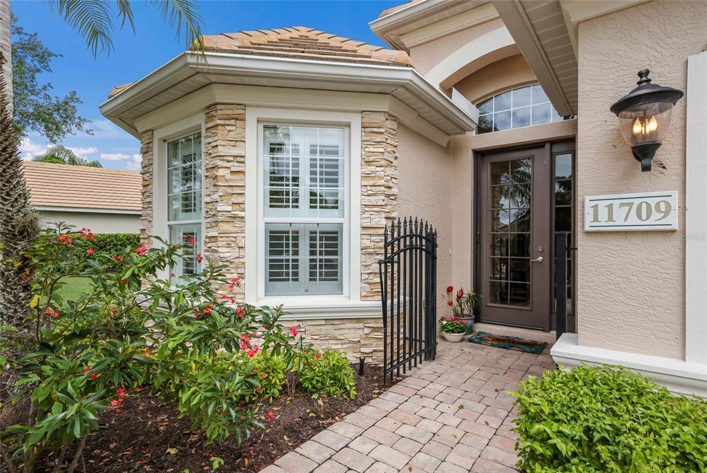 11709 Strandhill Court Lakewood Ranch, FL 34202 - Photo 5 of 51 a front view of a house with a yard