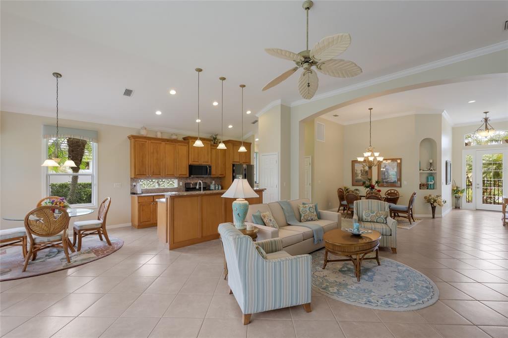11709 Strandhill Court Lakewood Ranch, FL 34202 - Photo 10 of 51 a living room with furniture and kitchen view