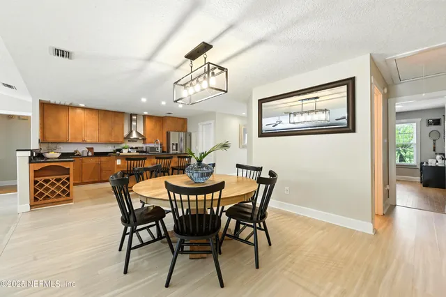 a kitchen with stainless steel appliances granite countertop counter space a sink and a stove