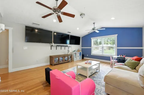 a living room with furniture and a window