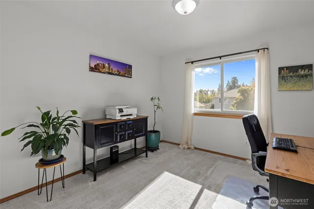 a workspace with furniture and window