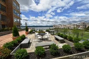 a view of a balcony with wooden floor and city view