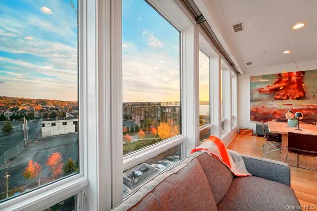 a living room with furniture tv and outdoor view