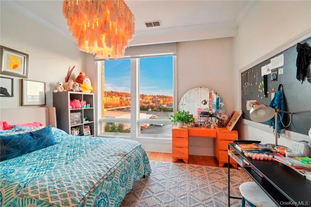 a living room with a large window and a table