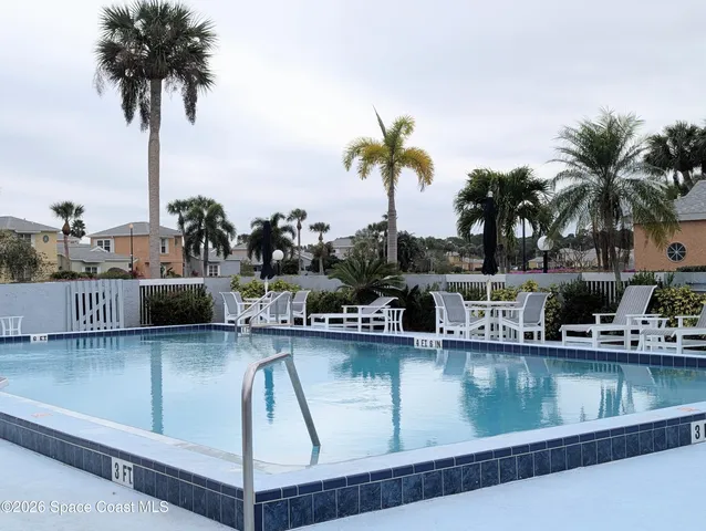 a view of a swimming pool with a lake view