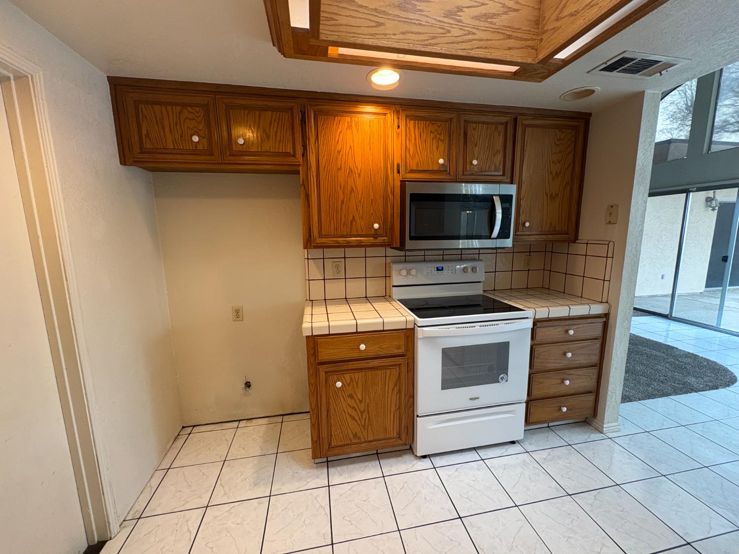 1829 Oak Leaf Drive Modesto, CA 95354 - Photo 11 of 31 a kitchen with a stove top oven and cabinets
