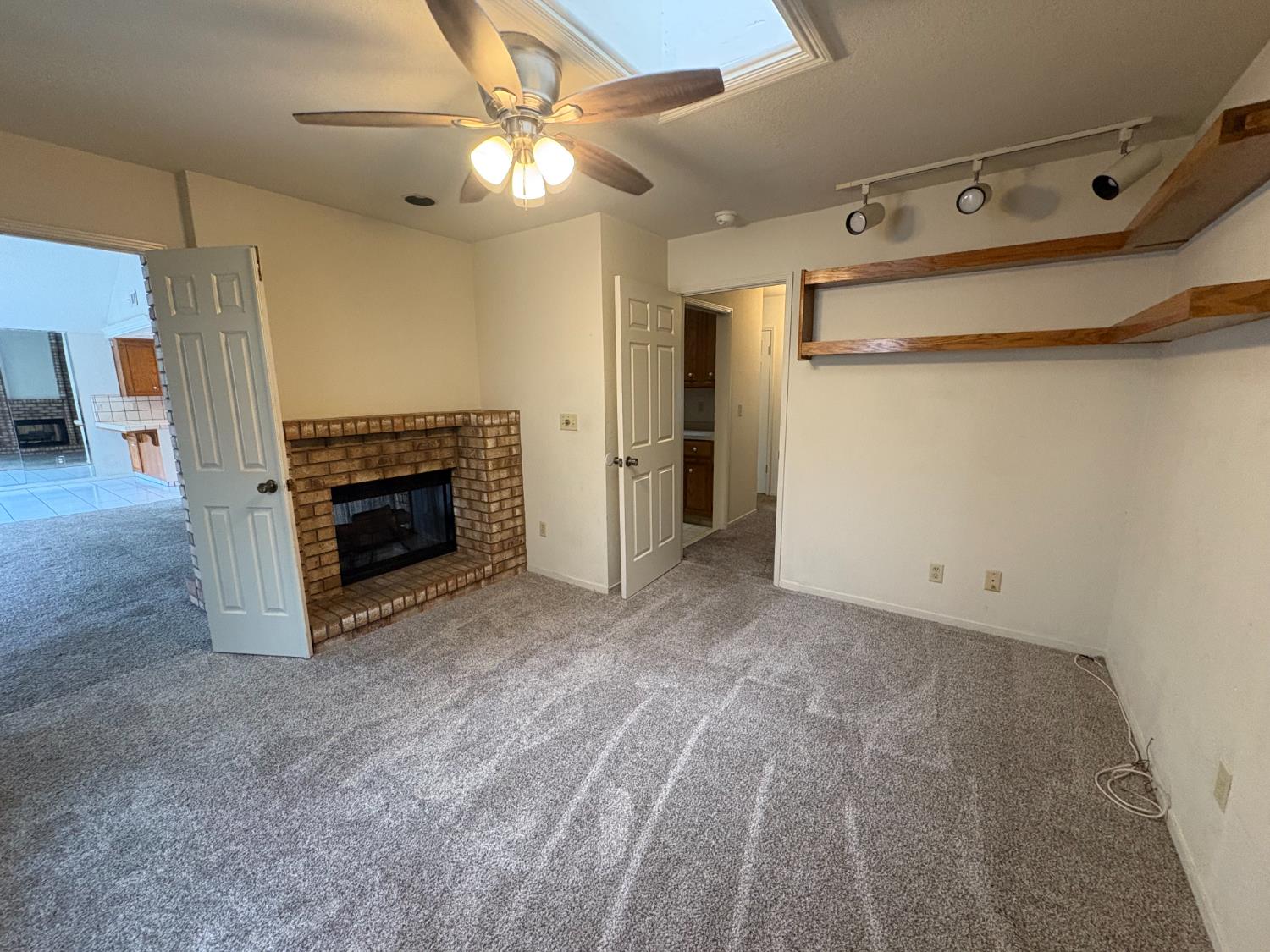 1829 Oak Leaf Drive Modesto, CA 95354 - Photo 14 of 31 a view of empty room with a fireplace and fan