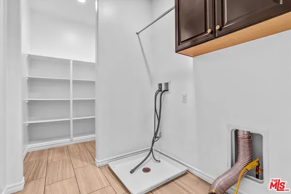 a view of a room with rack on the wall